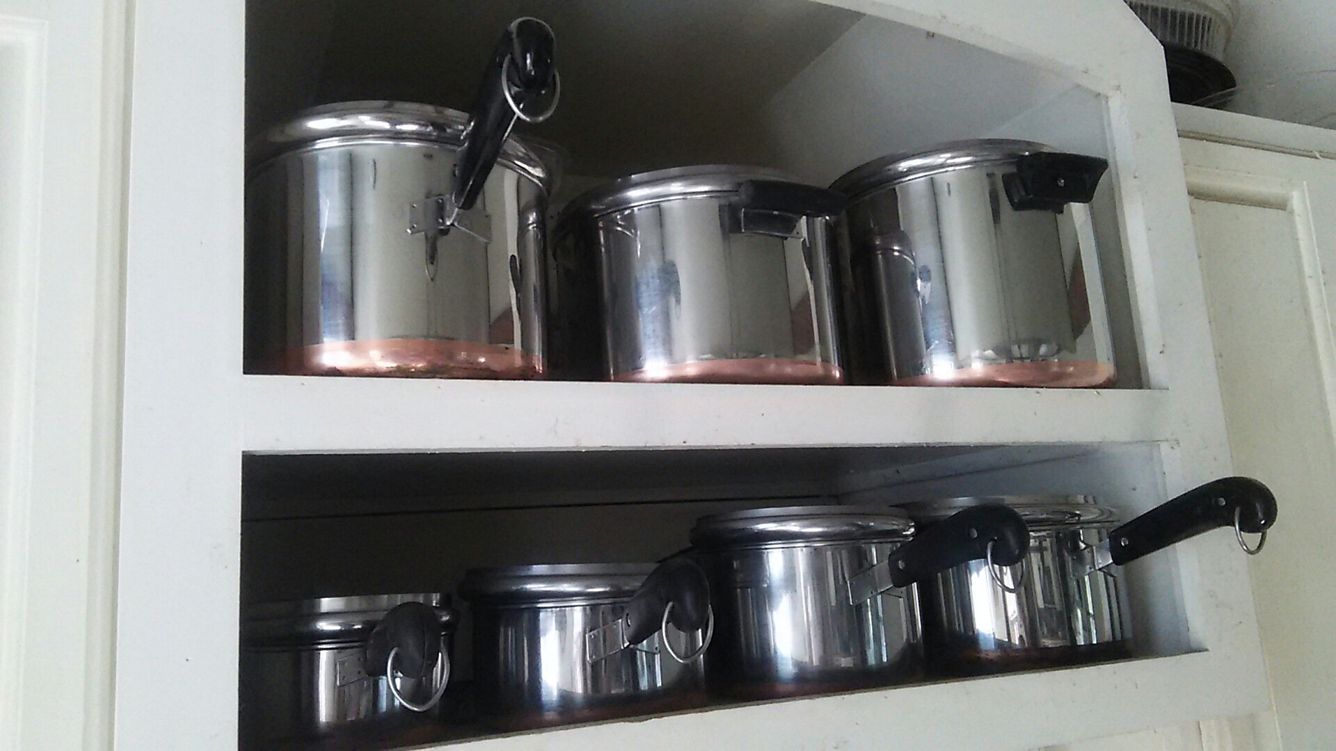 Set of Vintage copper-clad RevereWare pots.